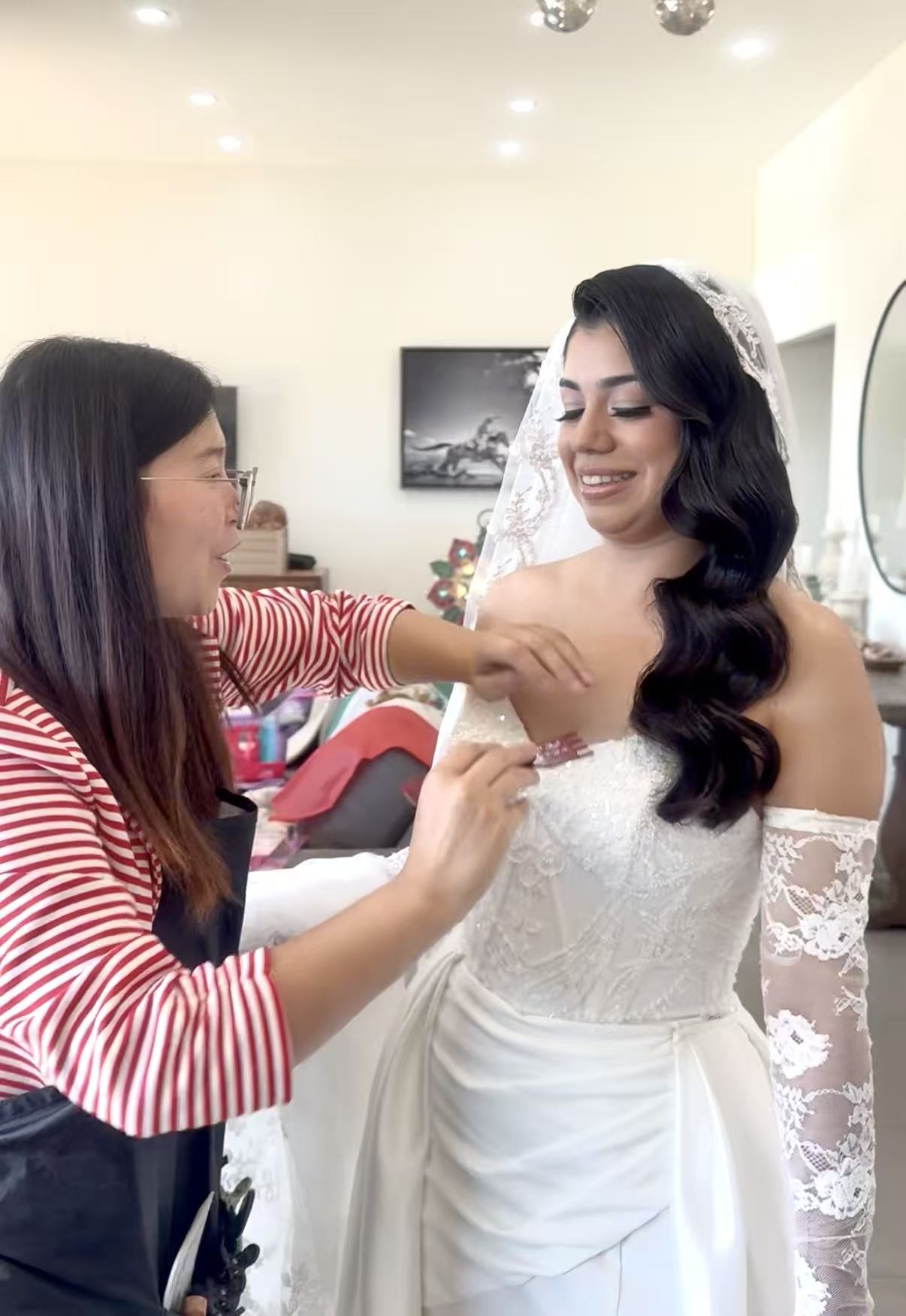 Rose making a final bridal beauty adjustment on a wedding morning
