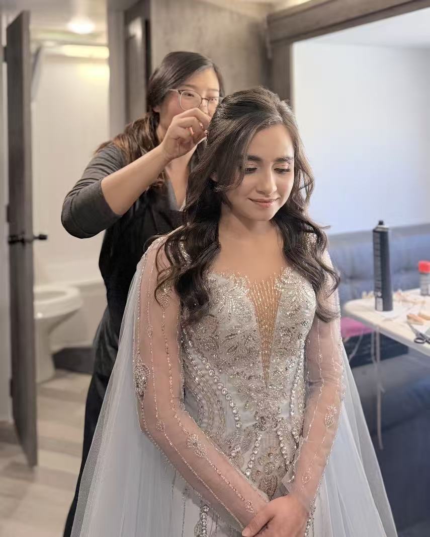 Rose styling bridal hair during wedding preparation