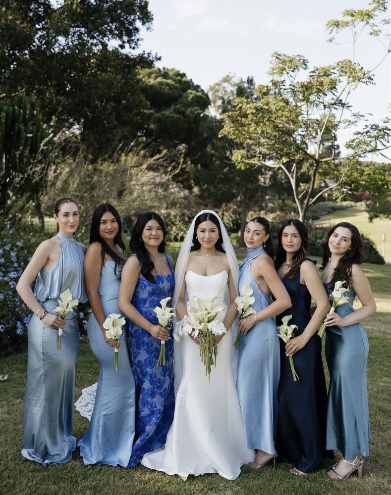 Bride with bridesmaids in blue dresses