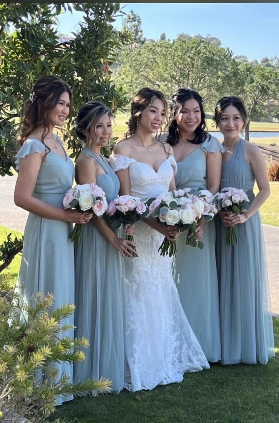 Bride with bridesmaids in a garden setting