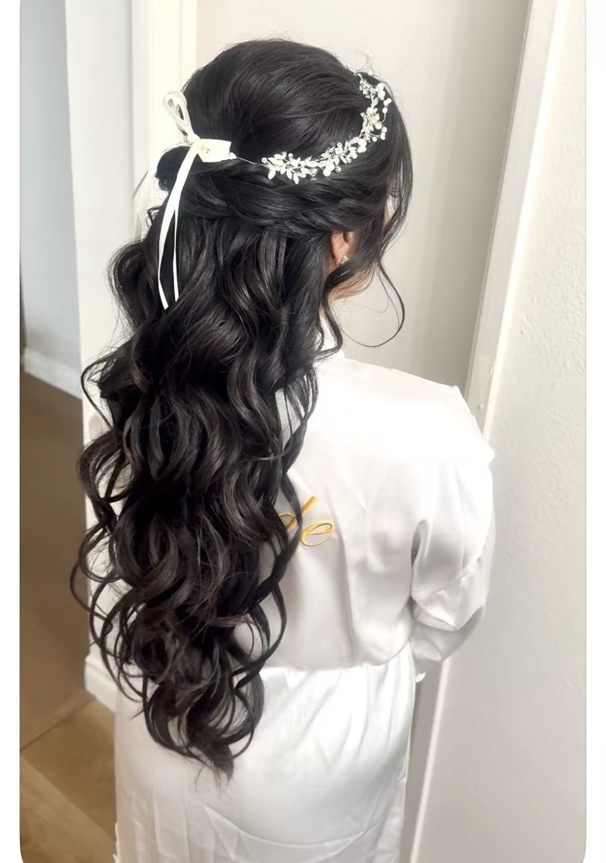 Half-up bridal hair with a jeweled accessory