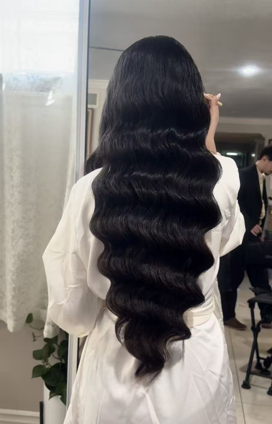 Long polished Hollywood waves viewed from the back